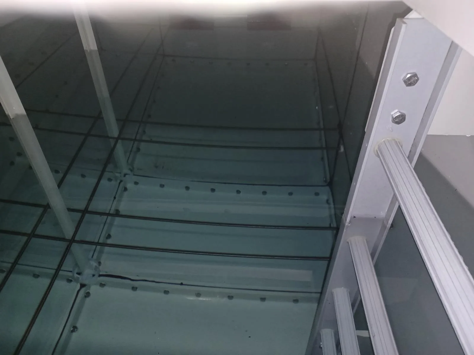 The clean interior of a cold water storage tank after disinfection